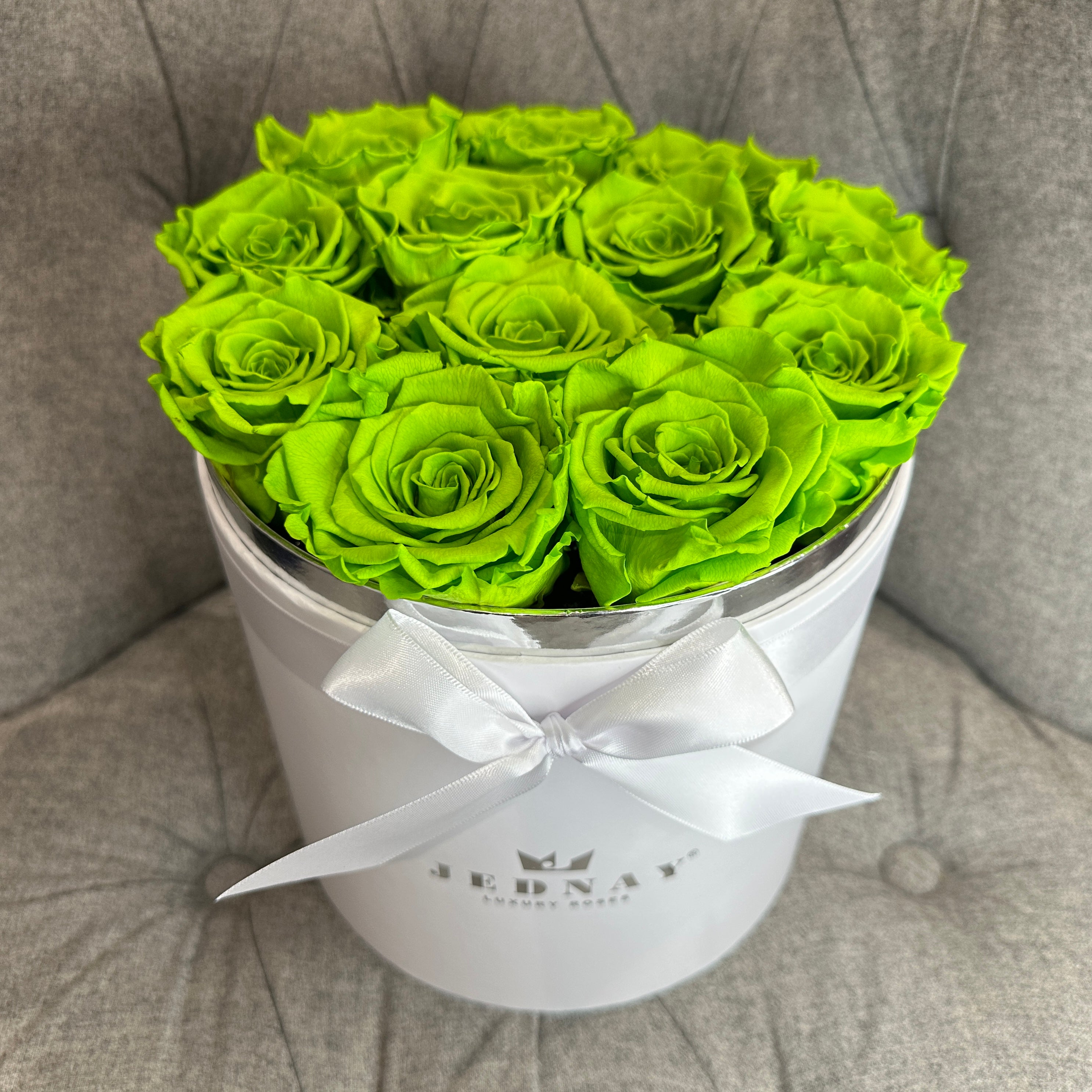 Lime green forever roses in a large white gift box by Jednay 