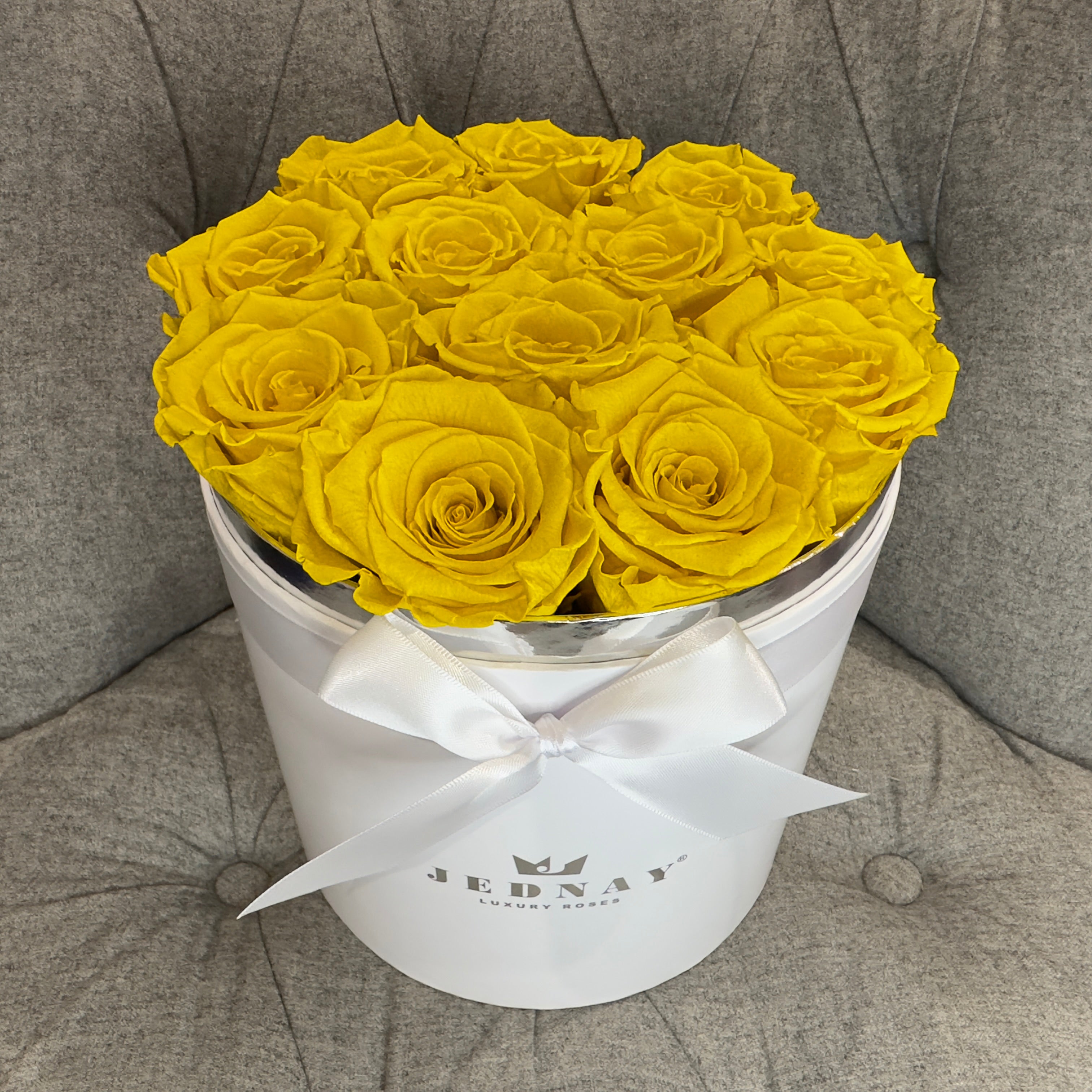 Yellow preserved eternal roses in a large round white gift box by Jednay 